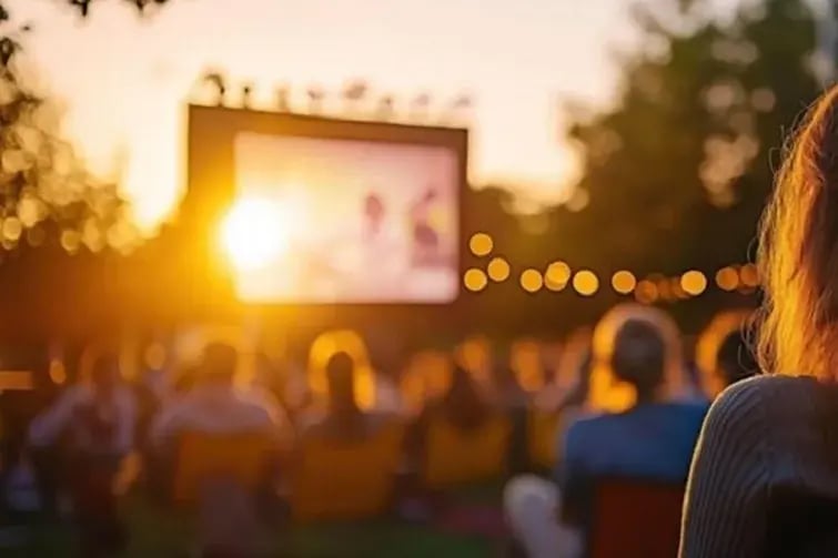 Esplanade-Chill-Cove-outdoor-movie-night-people-enjoying-film-under-the-evening-sky-photo