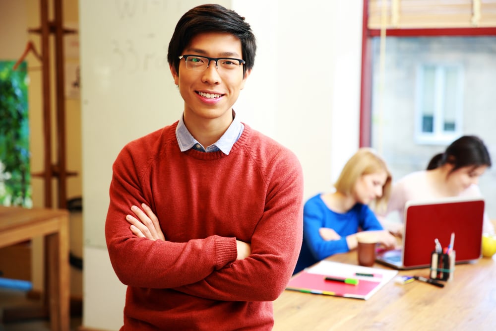 Happy young asian student in classroom